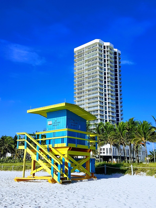 Skyscraper and lifeguard station on the beach