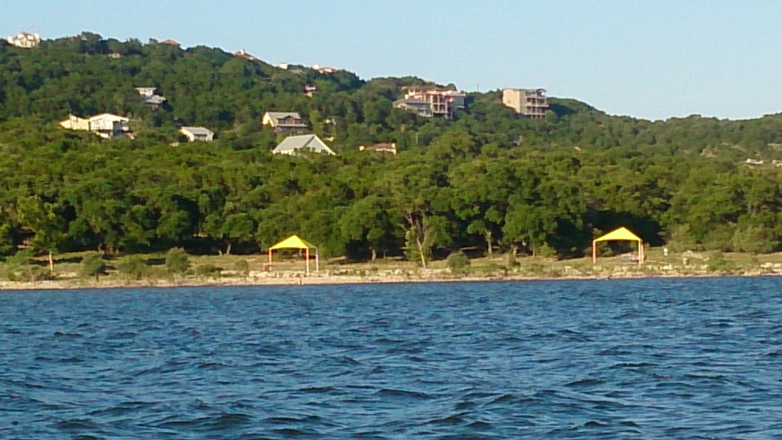 Blue water and green trees