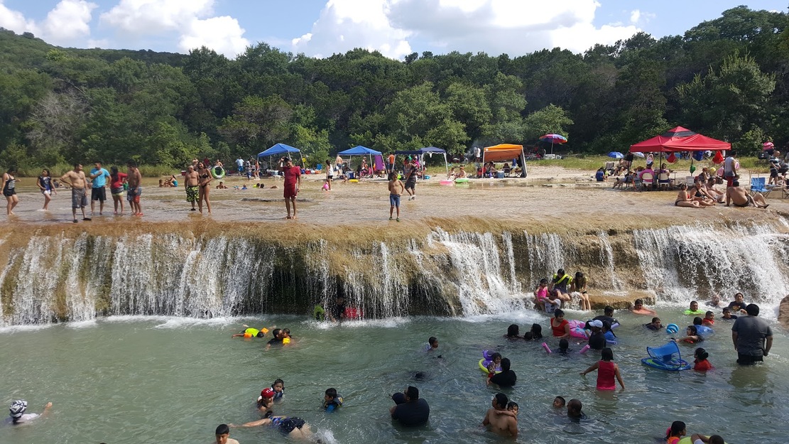 People bathing in the creek