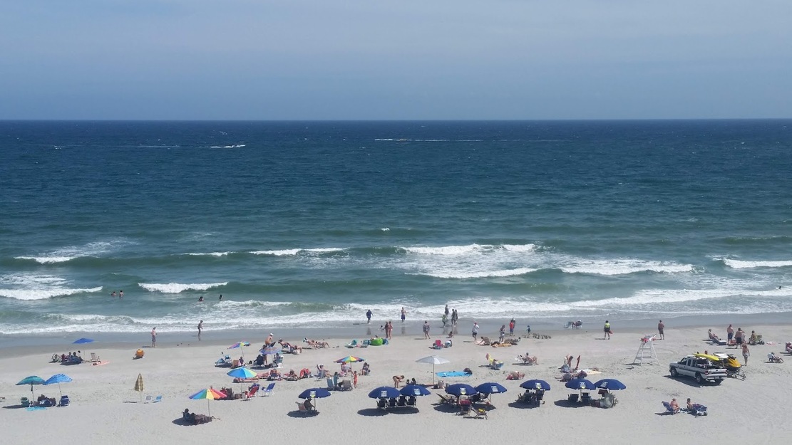 People sunbathing on Windy Hill Beach SC