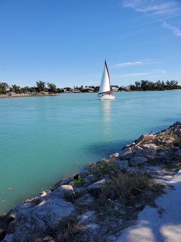 Boat sailing near South Jetty Beach, FL