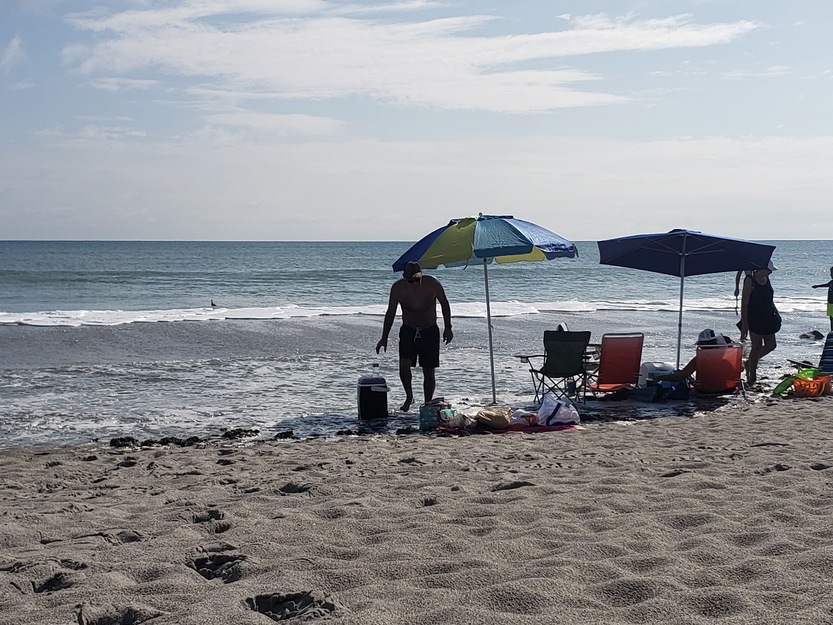 People on Spessard Holland North Beach