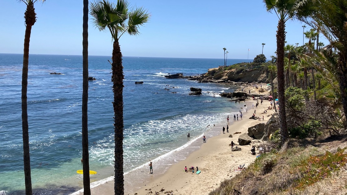 People sunbathing on Victoria Beach, Laguna Beach, CA