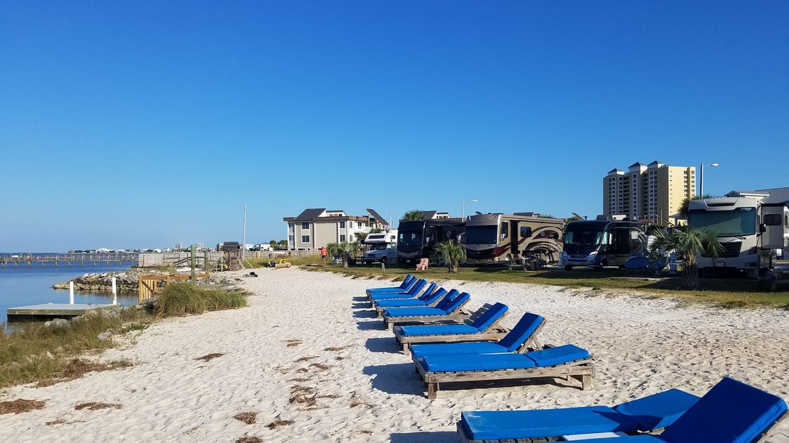 Blue sunbeds on the beach