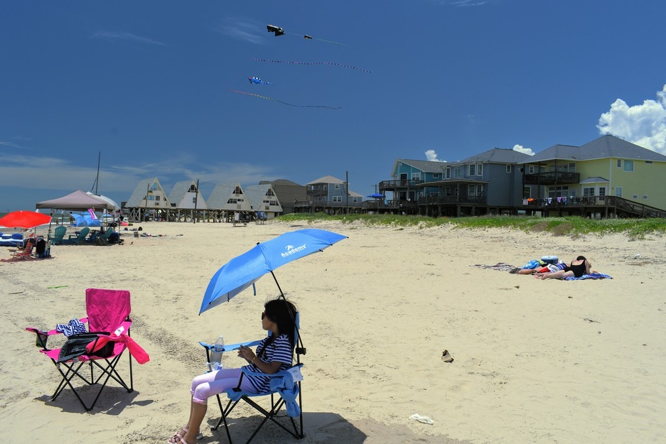 Woman relaxing in a beach armchair